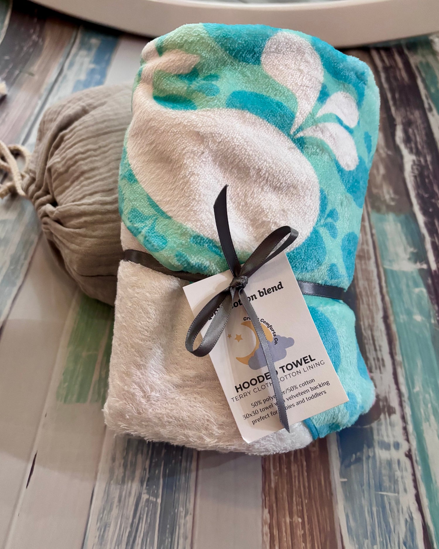 folded hooded whale baby towel